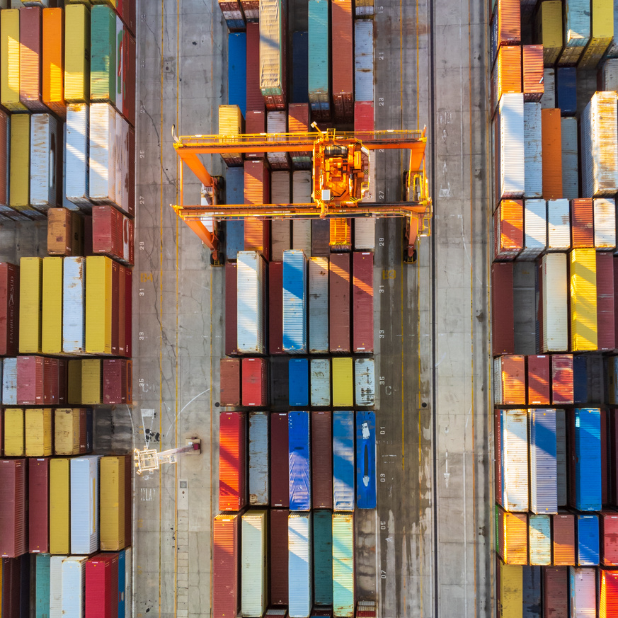 Aerial View of Shipping Container Port Terminal. Colourful Pattern of Containers in Harbor. Maritime Logistics Global Inport Export Trade Transportation.